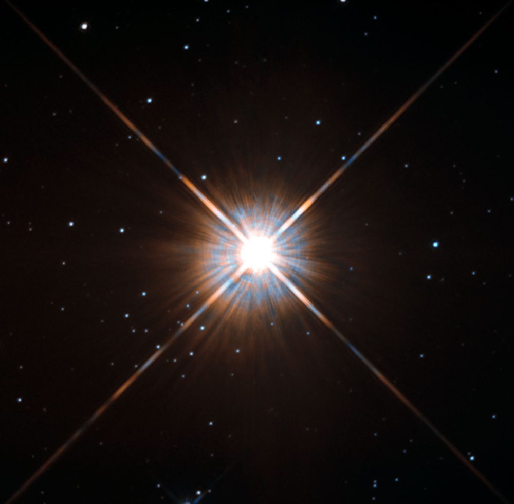 Próxima Centauri vista por el telescopio Hubble: una estrella brillante con picos de difracción sobre un fondo de estrellas
